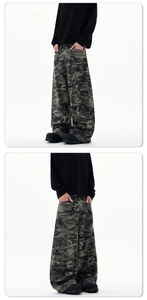 Detail of baggy camouflage cargo pants with multi-pockets and oversized silhouette cut