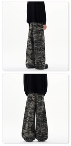 Detail of baggy camouflage cargo pants with multi-pocket design and street style cut