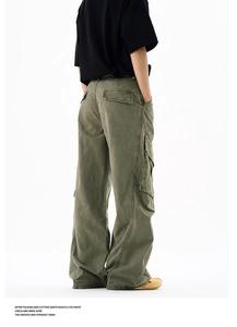 Rear view of olive green cargo pants showing vintage washed fabric and large utility pockets