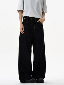 High-waist deep indigo wide-leg denim jeans with straight-cut fit and visible stitching