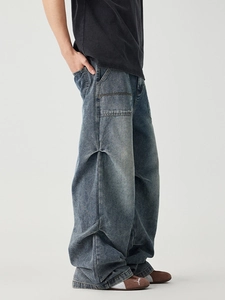 Vintage wash blue wide-leg denim cargo pants with workwear pocket details and side pleats