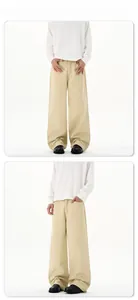 Detailansicht der khakifarbenen Hose mit weitem Bein, hoher Taille und Baumwolltwill-Gewebe