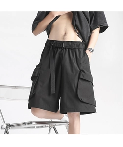 Detail of cargo shorts with utility pockets, elastic waistband, and nylon buckle belt