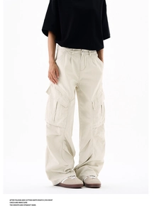 Detail of cargo pants showing oversized side flap pockets and twill cotton texture