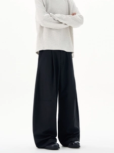 Minimalist men's light grey long sleeve sweatshirt and black wide leg pleated trousers
