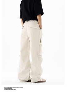 Detailed close-up of side cargo pockets and washed cotton fabric on streetwear pants