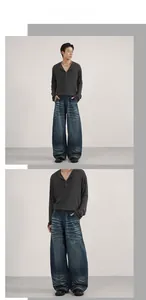 Detail of dark blue wide-leg jeans featuring heavy whiskering and vintage wash effects