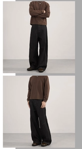 Detailed view of the wide-leg dark denim jeans showing fabric texture and loose silhouette