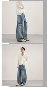 Detail view of light blue cargo jeans with large side pockets and clean fit style