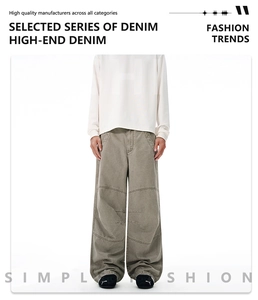 Detailed view of gray washed denim cargo pants featuring heavy cotton fabric and topstitching