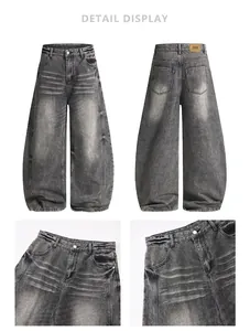 Detailansicht der verwaschenen schwarzgrauen Jeans mit hoher Taille und Lederetikett