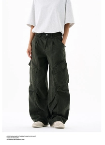 Detail view of olive cargo pants with 3D pleated knees and spacious side patch pockets
