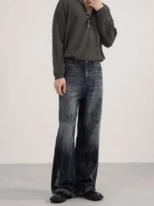Vintage wash blue grey wide leg flared jeans with a gradient distressed finish