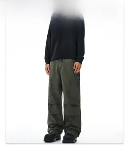 Detail of army green cargo denim pants with multi-pockets and wide-leg streetwear style