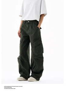 Detail view of olive green wide-leg cargo pants with classic utility pockets and knee pleats