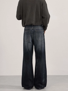 Retro washed blue flared denim jeans with vintage faded finish and wide leg cut style