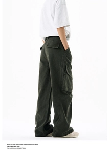 Detail view of baggy cargo pants with tactical flap pockets in washed charcoal grey