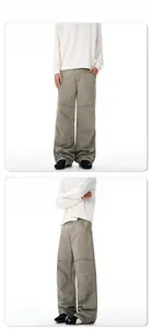 Detailed view of wide-leg cargo pants featuring washed fabric and pleated knee stitching