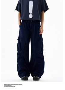 Detail of cargo pants side flap pocket with rugged cotton texture and street style seams