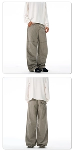 Detailed stitching on vintage cargo pants with a wide-leg design and wash canvas texture