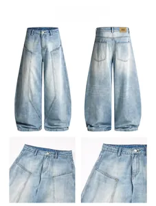 Detail view of light blue wide-leg jeans with panelled stitching and side pocket design