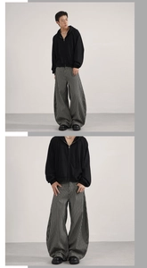Detail view of retro vertical stripe relaxed fit trousers with draped loose silhouette