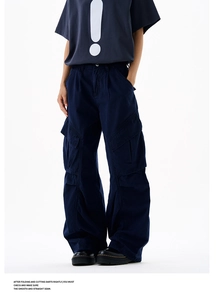 Detailed view of dark blue wide-leg cargo pants with large flap pockets and cotton fabric