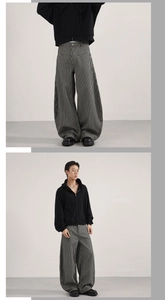 Detail of vintage striped wide-leg pants showing texture and relaxed silhouette