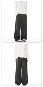 Front and back view of charcoal grey baggy cargo pants with double knee pleated stitching