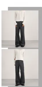 Detailed view of grey pinstripe wide-leg trousers with premium drape and high-waisted cut