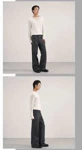Detailed view of grey striped wide-leg jeans with cleanfit style and a white top