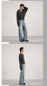 Detail of baggy wide-leg jeans with unique curved panel stitching and vintage washed finish