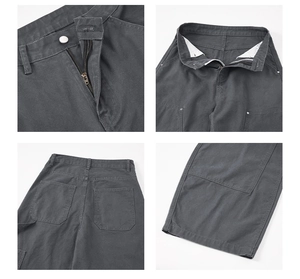 Dettaglio delle cuciture rinforzate, cerniera in metallo e tasche dei pantaloni cargo grigi