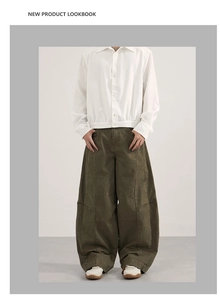 Detail view of American vintage deconstructed olive cargo pants and white drawstring shirt