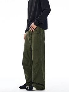 Retro washed olive green work pants with vintage paneled design and wide-leg cut