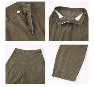 Detail of military green cargo pants showing metal zipper, belt loops and back pockets