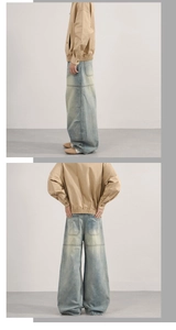 Détails du jean large bleu clair avec délavage vintage et design à empiècements