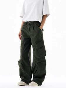 Faded dark green cargo pants with washed texture and streetwear knee pleats