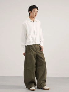 Men's vintage loose fit oversized trousers with white long-sleeve shirt casual outfit