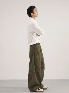 Men's olive green oversized cargo trousers and white jacket in a relaxed vintage fit