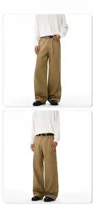 Model show of khaki wide-leg casual pants in durable cotton twill with belt detail