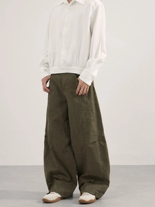 Men's olive green oversized cargo trousers with vintage deconstructed tailoring