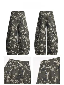 Macro detail of baggy grey jeans featuring all-over star prints and cargo pockets