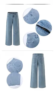 Detail view of light blue straight-leg denim jeans with white ink splash paint design