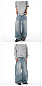 Classic vintage washed baggy jeans featuring wide leg fit and retro faded texture