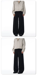 Detailed view of white pinstripe zip-up shirt and wide-leg black trousers in cleanfit style