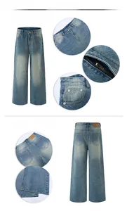 Detailed view of vintage washed blue straight denim jeans with metal zipper and leather patch