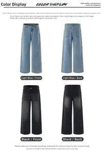 Detailed view of vintage washed straight jeans with white paint splatter and fading