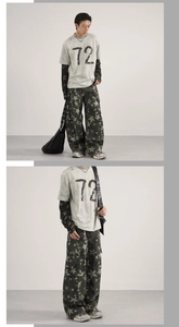Detail view of baggy camouflage pants with star pattern and vintage graphic t-shirt