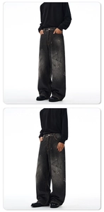 Front and side view of baggy dark grey jeans featuring white paint splatter details